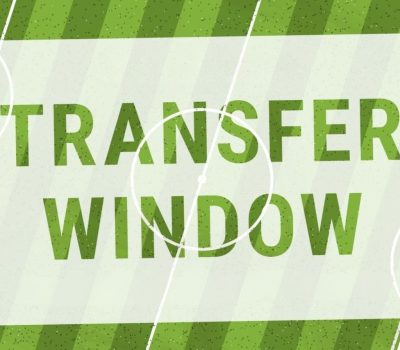 The words "Transfer Window" superimposed above a fake soccer field